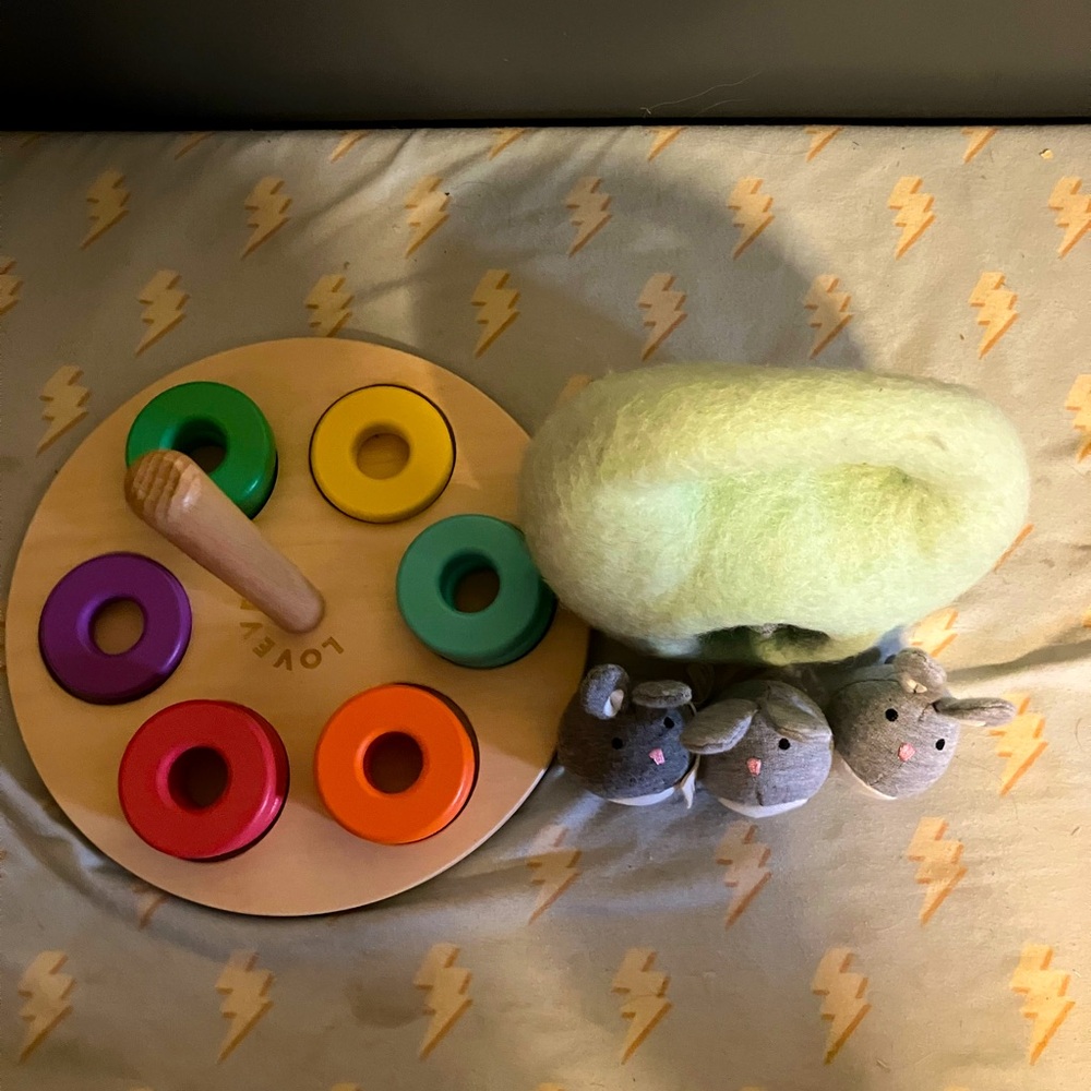 Lovevery flexible wooden stacker and bunnies in a felt burrow